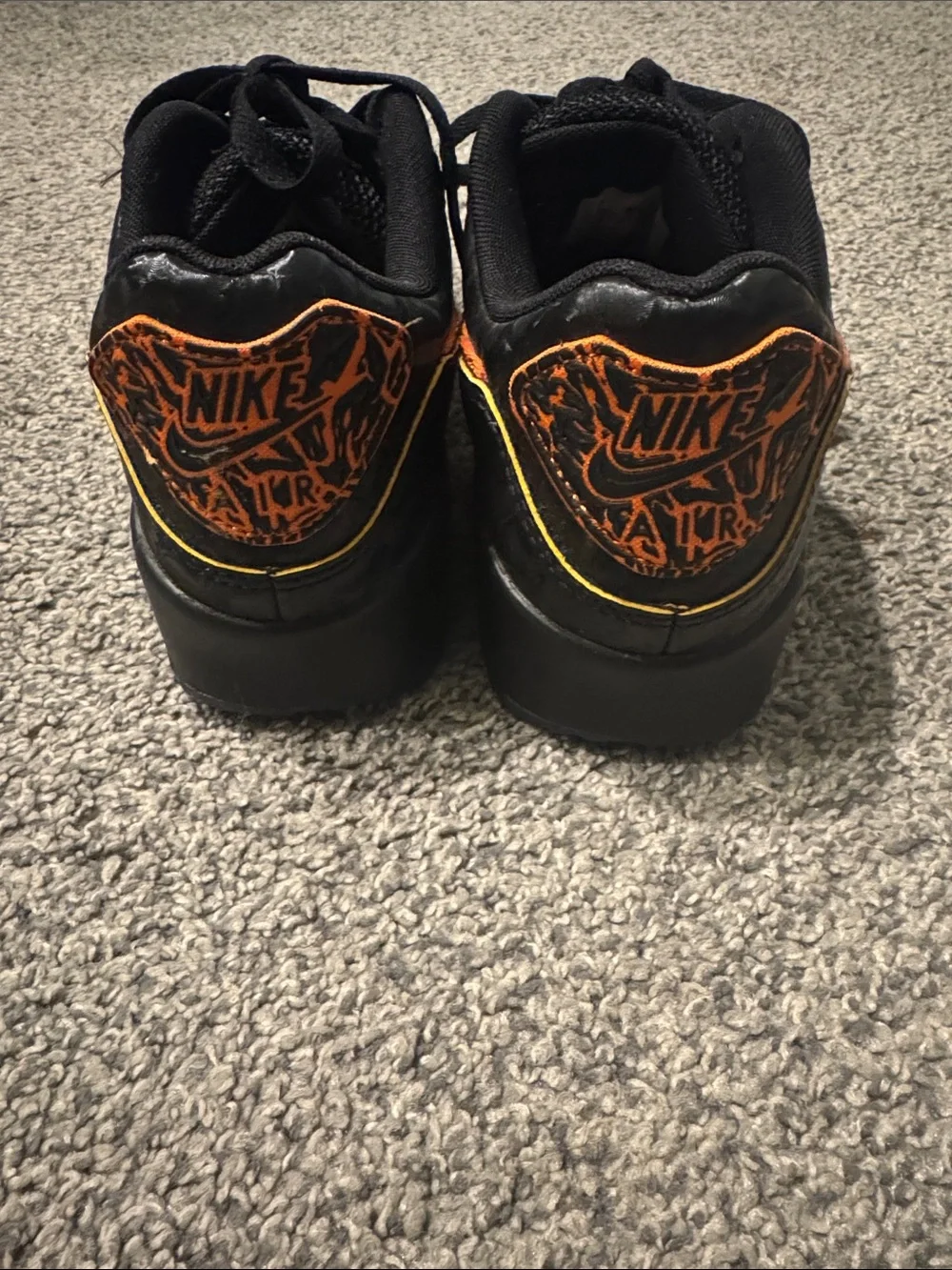 Nike Black Sneakers with Orange Accents